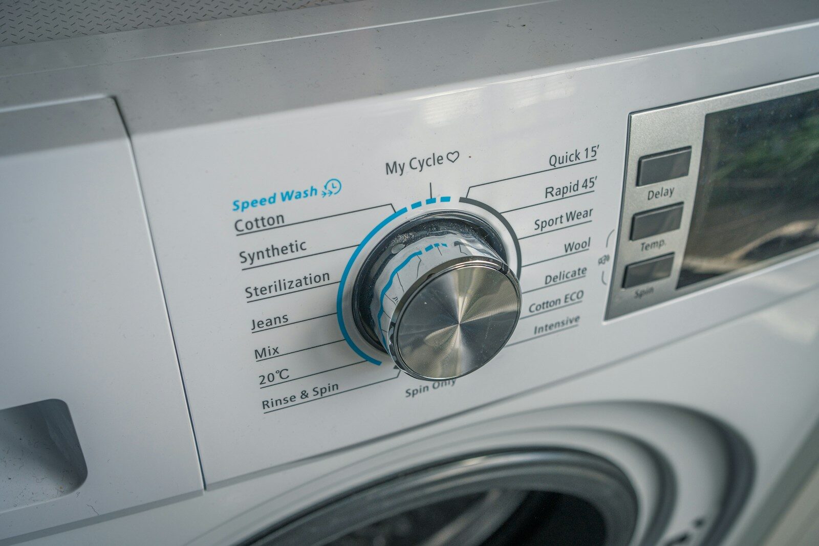 Photo by Limi change a close up of a washing machine with buttons